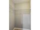 Empty walk-in closet featuring neutral paint and white wire shelving, ready for customization at 14059 Knightstown E Dr, Carmel, IN 46033