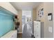 Hallway featuring coat hooks and shoe storage, designed for a functional and tidy entry at 14059 Knightstown E Dr, Carmel, IN 46033