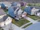 Charming two-story home with landscaped front yard, covered porch, and a neighborhood of similar homes at 14059 Knightstown E Dr, Carmel, IN 46033