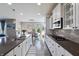 Gourmet kitchen features granite counters, stainless steel appliances, and a seamless flow into the dining area at 14059 Knightstown E Dr, Carmel, IN 46033