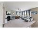 Spacious living room features a fireplace, large windows, and a neutral color palette at 14059 Knightstown E Dr, Carmel, IN 46033