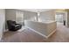 Cozy loft area with a leather chair and natural light, perfect for relaxing or reading at 14059 Knightstown E Dr, Carmel, IN 46033