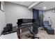 Home office setup with multiple monitors, ergonomic chair, and decor for a productive workspace at 14059 Knightstown E Dr, Carmel, IN 46033