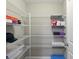 Spacious walk-in pantry with extensive shelving, providing ample storage space for kitchen goods at 14059 Knightstown E Dr, Carmel, IN 46033