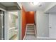 Carpeted staircase leading to the basement, with access to a bathroom and utility room at 14059 Knightstown E Dr, Carmel, IN 46033
