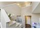 Open staircase with modern lighting, creating a bright and airy transition between levels at 14059 Knightstown E Dr, Carmel, IN 46033
