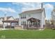 Exterior view of backyard featuring a covered pool, patio, grill, and green lawn at 1458 Longleaf St, Avon, IN 46123