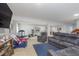 Spacious basement area with seating, exercise equipment, and a large TV at 1458 Longleaf St, Avon, IN 46123