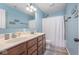 Bathroom featuring double sinks, a spacious mirror, and shower-tub combination at 1458 Longleaf St, Avon, IN 46123
