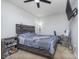 Comfortable bedroom with a ceiling fan and a rustic wooden bed frame, plus a TV on the wall at 1458 Longleaf St, Avon, IN 46123