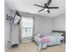 Relaxing bedroom with a wall-mounted TV, window, and modern ceiling fan at 1458 Longleaf St, Avon, IN 46123