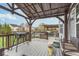 Outdoor deck with a grill, patio seating, and a view of the backyard pool at 1458 Longleaf St, Avon, IN 46123