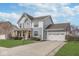 Beautifully designed two-story home featuring a well-manicured lawn, covered porch, and attached garage at 1458 Longleaf St, Avon, IN 46123