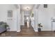 Cozy hallway with views of the living room and a neutral color palette for a warm ambiance at 1458 Longleaf St, Avon, IN 46123