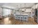 Modern kitchen boasts stainless steel appliances, an island with seating, and ample counter space at 1458 Longleaf St, Avon, IN 46123