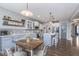 Charming kitchen features stylish two-tone cabinetry, an island with seating, and an open design at 1458 Longleaf St, Avon, IN 46123