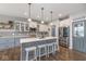 Modern kitchen boasts stainless steel appliances, an island with seating, and ample counter space at 1458 Longleaf St, Avon, IN 46123