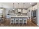 Modern kitchen boasts stainless steel appliances, an island with seating, and ample counter space at 1458 Longleaf St, Avon, IN 46123