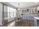 Open kitchen features seating, cabinetry, natural light, and view to yard at 1458 Longleaf St, Avon, IN 46123
