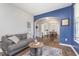 Cozy living room showcasing an open layout with stylish decor, seamlessly flowing into the dining area at 1458 Longleaf St, Avon, IN 46123