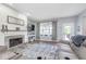 Comfortable living room features a stone fireplace, plush seating, and stylish decor at 1458 Longleaf St, Avon, IN 46123