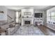 Comfortable living room features a stone fireplace, plush seating, and stylish decor at 1458 Longleaf St, Avon, IN 46123