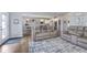Open living space flows to kitchen area, featuring plush seating and decor at 1458 Longleaf St, Avon, IN 46123