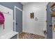 Well-designed mudroom with brick floors, bench seating, and practical storage solutions at 1458 Longleaf St, Avon, IN 46123