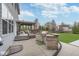 Spacious patio featuring an outdoor kitchen with grill and pergola-covered seating area at 1458 Longleaf St, Avon, IN 46123