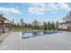Backyard view featuring a pool covered for the off-season, green space, and a wood fence at 1458 Longleaf St, Avon, IN 46123