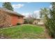 Spacious backyard featuring lush green grass and a charming swing, perfect for outdoor enjoyment at 1526 Chapman Dr, Greenfield, IN 46140