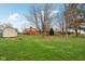 The home has a beautiful and spacious backyard with mature trees providing shade and privacy at 1526 Chapman Dr, Greenfield, IN 46140