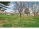 The home has a big, green backyard with trees, and has plenty of open space for outdoor activities at 1526 Chapman Dr, Greenfield, IN 46140