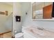 Bathroom featuring a sink and toilet with a vanity, adding a touch of elegance and functionality to this room at 1526 Chapman Dr, Greenfield, IN 46140