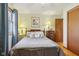Charming bedroom features a cozy bed, bedside tables, and a window with curtains at 1526 Chapman Dr, Greenfield, IN 46140