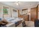 Bedroom featuring a bed with decorative pillows and a large dresser, ensuring relaxation and practicality at 1526 Chapman Dr, Greenfield, IN 46140