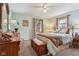 Inviting bedroom with a wooden bed frame, dresser, and two windows offering natural light at 1526 Chapman Dr, Greenfield, IN 46140