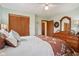 Comfortable bedroom featuring a dresser, closet with sliding doors, and an inviting bed at 1526 Chapman Dr, Greenfield, IN 46140