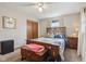 Bedroom with a wooden bed and a ceiling fan, creating a harmonious blend of comfort and functionality at 1526 Chapman Dr, Greenfield, IN 46140