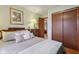 Comfortable bedroom featuring a bed, dresser, and closet with sliding doors at 1526 Chapman Dr, Greenfield, IN 46140