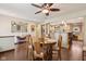 Dining room that opens to the kitchen area, featuring hardwood floors and a decorative mirror at 1526 Chapman Dr, Greenfield, IN 46140