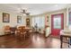 Cozy dining room with hardwood floors, a round table, and a ceiling fan for added comfort at 1526 Chapman Dr, Greenfield, IN 46140