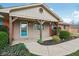 Charming covered entryway featuring wooden pillars, tiled accents, and a brightly colored door at 1526 Chapman Dr, Greenfield, IN 46140