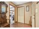 Hallway featuring exposed beams and access to the main living room at 1526 Chapman Dr, Greenfield, IN 46140
