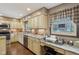 Well-appointed kitchen with granite counters, stainless steel appliances, and window seating at 1526 Chapman Dr, Greenfield, IN 46140