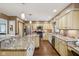 Spacious kitchen boasts granite countertops, stainless appliances, and custom cabinets, creating a chef-friendly space at 1526 Chapman Dr, Greenfield, IN 46140