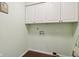 Laundry room with overhead cabinets and washer hookups at 1526 Chapman Dr, Greenfield, IN 46140