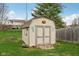 Outdoor storage shed sitting on a lush lawn, perfect for storing gardening supplies and outdoor equipment at 1526 Chapman Dr, Greenfield, IN 46140