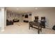Versatile finished basement with game tables, entertainment area, and comfortable seating, ideal for entertainment at 1559 Redsunset Dr, Brownsburg, IN 46112