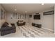 Finished basement offering a cozy seating area, entertainment setup, and stylish decor, perfect for relaxation at 1559 Redsunset Dr, Brownsburg, IN 46112
